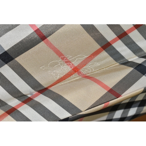 424 - A BURBERRY SHOOTING STICK, in traditional Burberry check fabric and brown leather seat, length 1m (1... 