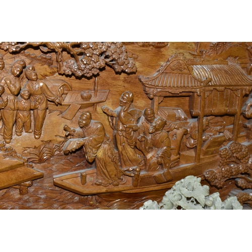 431 - A LARGE ORIENTAL CAMPHOR WOOD WALL HANGING AND FOUR ORIENTAL CARVED STONE ORNAMENTS, comprising a la... 