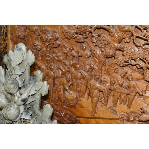 431 - A LARGE ORIENTAL CAMPHOR WOOD WALL HANGING AND FOUR ORIENTAL CARVED STONE ORNAMENTS, comprising a la... 