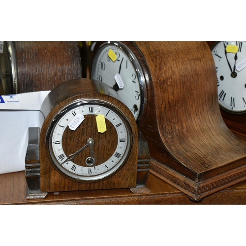 432 - FIVE WOODEN CASED MANTEL CLOCKS, comprising one clock with satinwood inlay decoration and four oak c... 