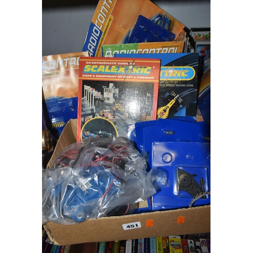 451 - TWO BOXES OF RADIO CONTROL PARTS, ETC, to include twenty eight Radio Control partworks (most still s... 