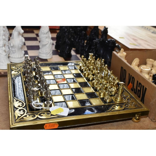 476 - SIX SETS OF CHESS, comprising an Estrella wooden case of 'Classic Games', a small table top chess bo... 