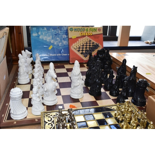 476 - SIX SETS OF CHESS, comprising an Estrella wooden case of 'Classic Games', a small table top chess bo... 