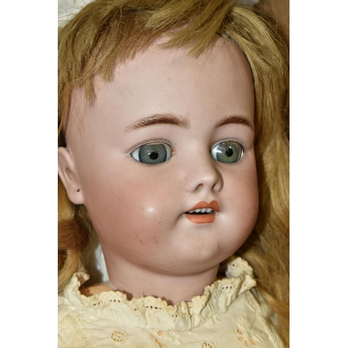 555 - A BOXED LATE 19TH / EARLY 20TH CENTURY GERMAN BISQUE HEADED DOLL, with sleeping eyes, open mouth wit... 