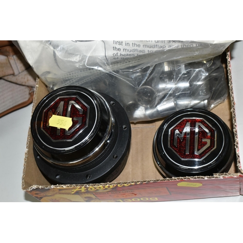 556 - TWO VINTAGE M.G  STEERING WHEELS, made by Moto-Lita, with M.G centre pieces (1 box + loose)