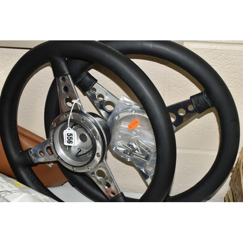 556 - TWO VINTAGE M.G  STEERING WHEELS, made by Moto-Lita, with M.G centre pieces (1 box + loose)