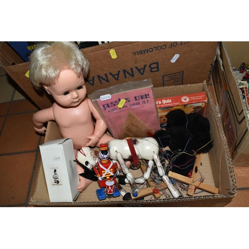 563 - TWO BOXES OF VINTAGE PUZZLES, BOARD GAMES AND PUPPETS, to include a Pelham black French Poodle puppe... 