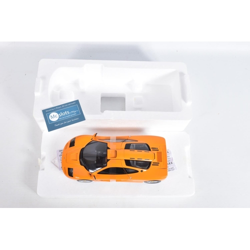 24 - A BOXED MINICHAMPS MCLAREN F1 ROAD CAR 1994 1:18 MODEL VEHICLE, numbered 530 133421, painted orange,... 