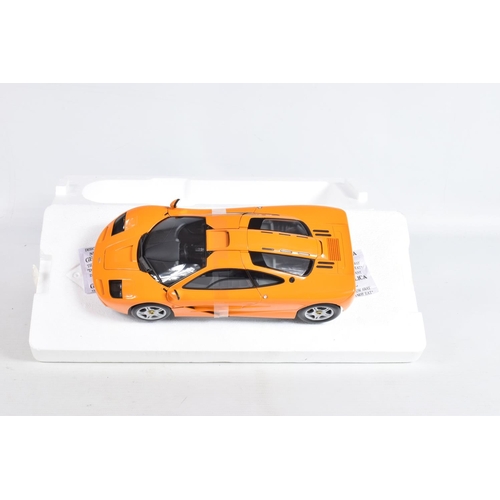 24 - A BOXED MINICHAMPS MCLAREN F1 ROAD CAR 1994 1:18 MODEL VEHICLE, numbered 530 133421, painted orange,... 