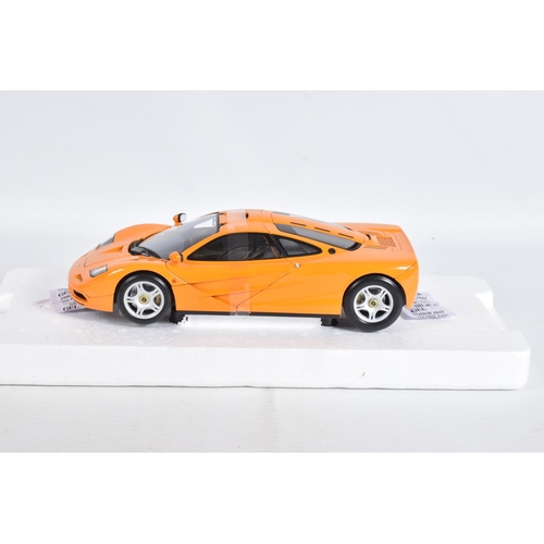 24 - A BOXED MINICHAMPS MCLAREN F1 ROAD CAR 1994 1:18 MODEL VEHICLE, numbered 530 133421, painted orange,... 