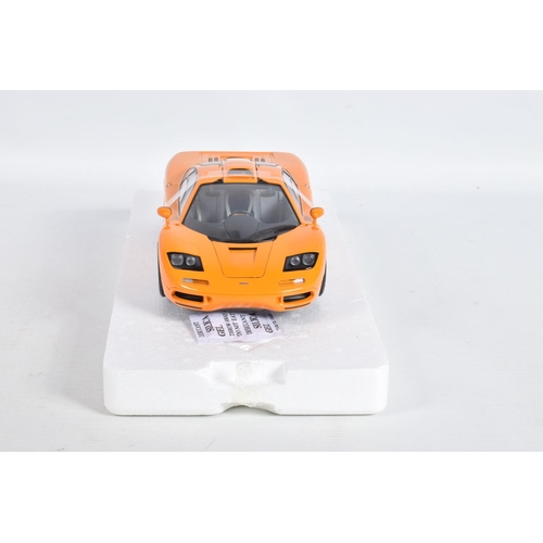 24 - A BOXED MINICHAMPS MCLAREN F1 ROAD CAR 1994 1:18 MODEL VEHICLE, numbered 530 133421, painted orange,... 