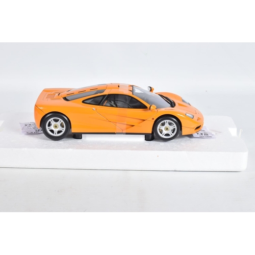 24 - A BOXED MINICHAMPS MCLAREN F1 ROAD CAR 1994 1:18 MODEL VEHICLE, numbered 530 133421, painted orange,... 