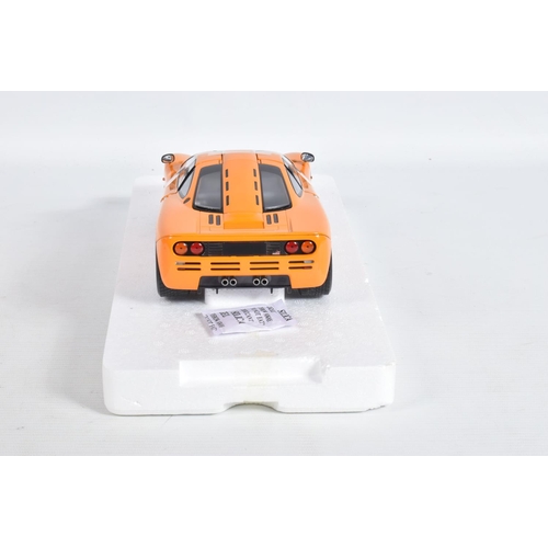 24 - A BOXED MINICHAMPS MCLAREN F1 ROAD CAR 1994 1:18 MODEL VEHICLE, numbered 530 133421, painted orange,... 