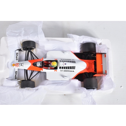 29 - A BOXED MINICHAMPS MCLAREN MP 4/4 HONDA AYRTON SENNA 1:18 MODEL RACECAR, numbered 540 881812, painte... 