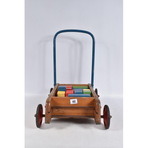 42 - A TRI-ANG BABY WALKER, wooden construction with red painted wheels and black tyres, blue handle with... 