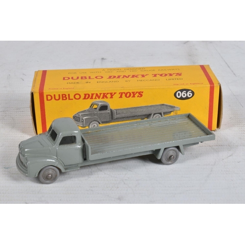 62 - FOUR BOXED DUBLO DINKY DIECAST VEHICLES, Austin Lorry, No.064, Bedford Flat Truck, No.066, A.E.C. Me... 