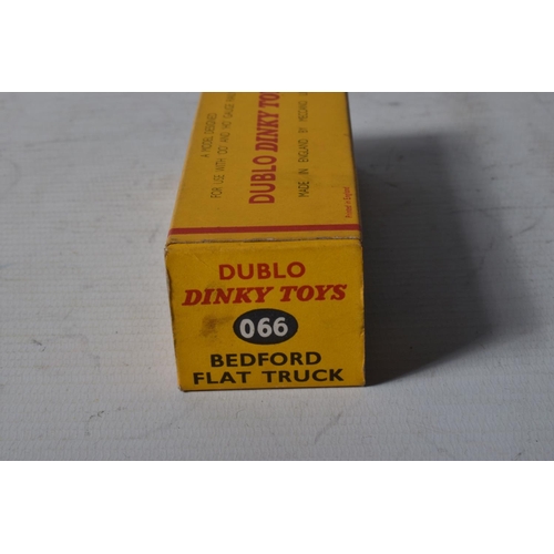 62 - FOUR BOXED DUBLO DINKY DIECAST VEHICLES, Austin Lorry, No.064, Bedford Flat Truck, No.066, A.E.C. Me... 