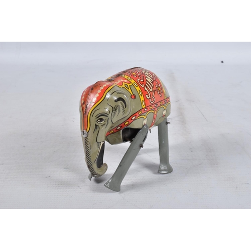 98 - A BOXED MOKO JUMBO THE WALKING ELEPHANT WIND UP TIN PLATE TOY, grey body with a decorative faded red... 