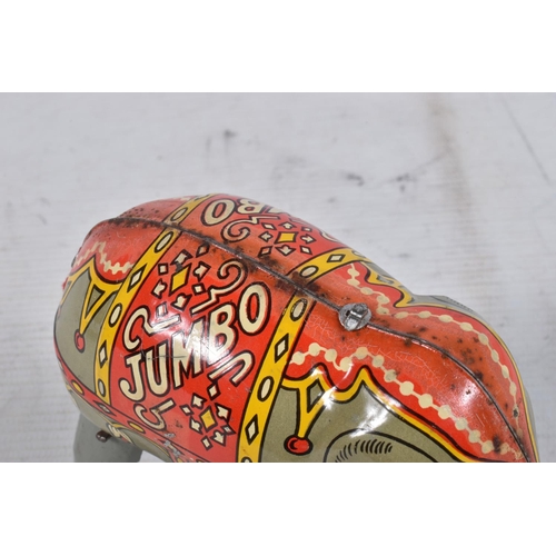 98 - A BOXED MOKO JUMBO THE WALKING ELEPHANT WIND UP TIN PLATE TOY, grey body with a decorative faded red... 