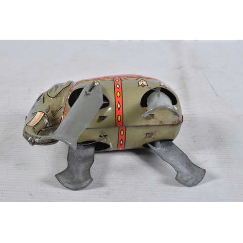 98 - A BOXED MOKO JUMBO THE WALKING ELEPHANT WIND UP TIN PLATE TOY, grey body with a decorative faded red... 