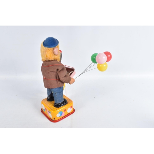 116 - A BOXED YONEZAWA BATTERY OPERATED TINPLATE BALLOON VENDOR, not tested, tinplate base with dressed fi... 