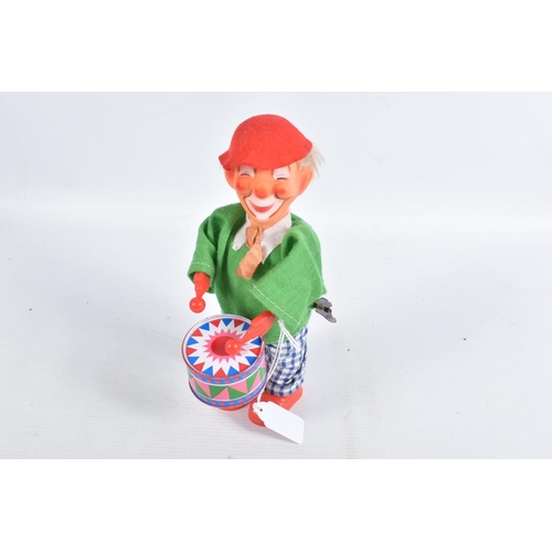 116 - A BOXED YONEZAWA BATTERY OPERATED TINPLATE BALLOON VENDOR, not tested, tinplate base with dressed fi... 