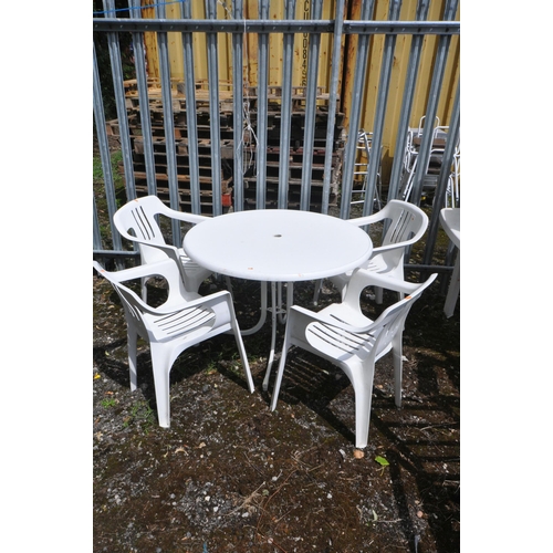 1001 - A PLASTIC CIRCULAR GARDEN TABLE, diameter 102cm x height 71cm and four armchairs (5)