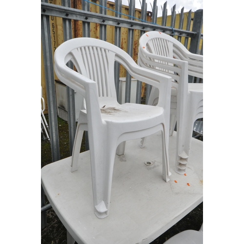1002 - A PLASTIC RECTANGULAR GARDEN TABLE, length 138cn x depth 84cm x height 74cm, nine matching armchairs... 