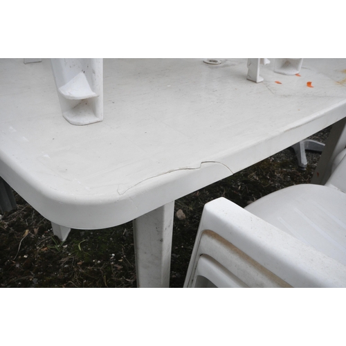 1002 - A PLASTIC RECTANGULAR GARDEN TABLE, length 138cn x depth 84cm x height 74cm, nine matching armchairs... 