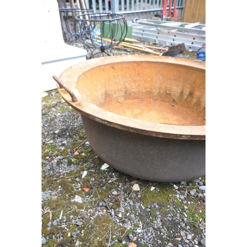 1007 - A VINTAGE CAST IRON TWIN HANDLED BASIN/BOWL, diameter 77cm x height 33cm