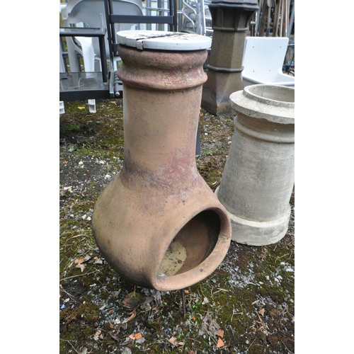 1008 - A VINTAGE TERRACOTTA CHIMINEA, with a painted lid on a wire stand, diameter 40cm x height 74cm, and ... 