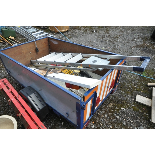 1011 - A SINGLE AXLE BOX TRAILER, with tail boards and cables, along with an aluminium step ladder (conditi... 