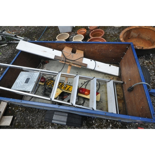 1011 - A SINGLE AXLE BOX TRAILER, with tail boards and cables, along with an aluminium step ladder (conditi... 