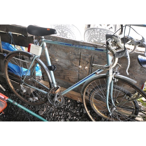 1014 - A PEUGEOT PALE BLUE GENTS BICYCLE, and a Raleigh super burner gold child's bike (condition report: -... 