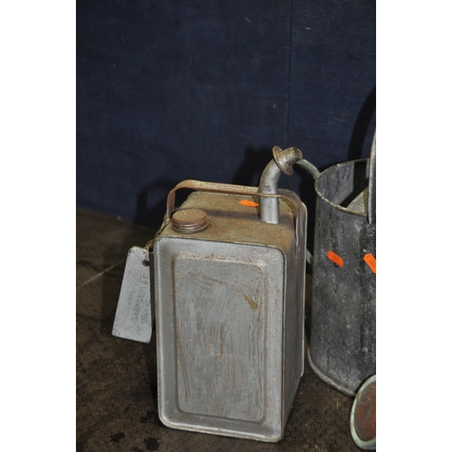 1051 - A COLLECTION OF VINTAGE FUEL CANS comprising of a Pratts petrol can with brass cap, an Aladdin Pink ... 