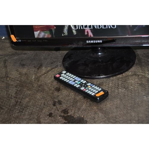 1054 - A SAMSUNG LT24A350EW 24in TV with remote (PAT pass and working)