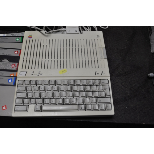 1056 - AN APPLE 2C PERSONAL COMPUTER (powers up but not tested any further) with power supply, a G092S moni... 