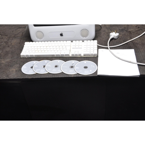 1057 - AN APPLE eMAC E1002 EMC 1955 PERSONAL COMPUTER with keyboard, User Guide and five software discs (PA... 