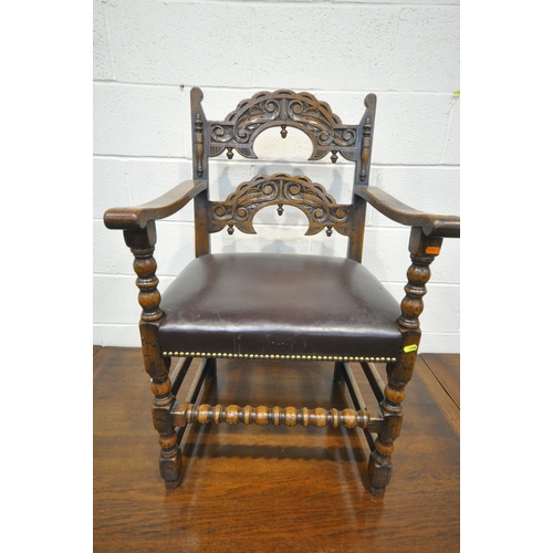 1199 - A REPRODUCTION OAK TRESTLE DRAW LEAF DINING TABLE, on square tapered legs, with foliate detailing, o... 