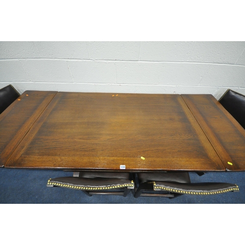 1199 - A REPRODUCTION OAK TRESTLE DRAW LEAF DINING TABLE, on square tapered legs, with foliate detailing, o... 