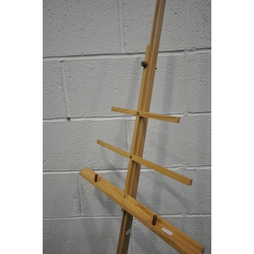 1201 - A BESPOKE MAPLE MUSIC STAND, with eight height levels, on a shaped base, height 167cm (condition - e... 