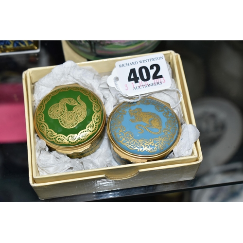 402 - A COLLECTION OF ENAMELLED PILL BOXES, seven boxed Halcyon Days pill boxes comprising 1996 Year of th... 