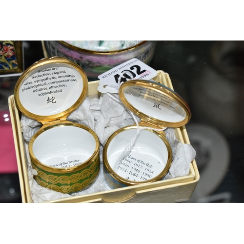 402 - A COLLECTION OF ENAMELLED PILL BOXES, seven boxed Halcyon Days pill boxes comprising 1996 Year of th... 