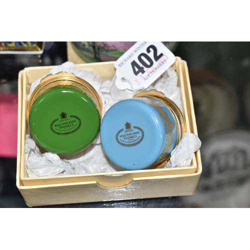 402 - A COLLECTION OF ENAMELLED PILL BOXES, seven boxed Halcyon Days pill boxes comprising 1996 Year of th... 