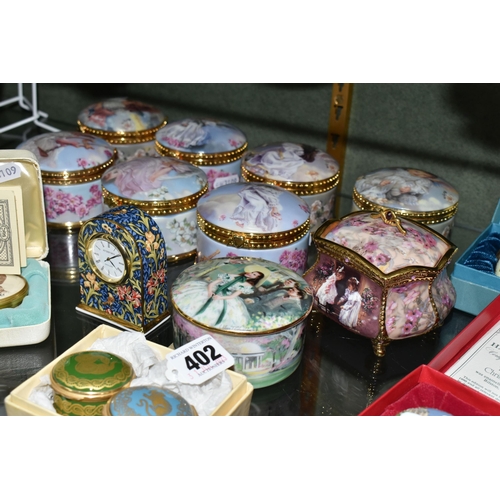 402 - A COLLECTION OF ENAMELLED PILL BOXES, seven boxed Halcyon Days pill boxes comprising 1996 Year of th... 