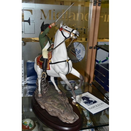 632 - A FRANKLIN MINT PORCELAIN FIGURE 'NAPOLEON', designed by Ronald Van Ruyckevelt, mounted on a wooden ... 