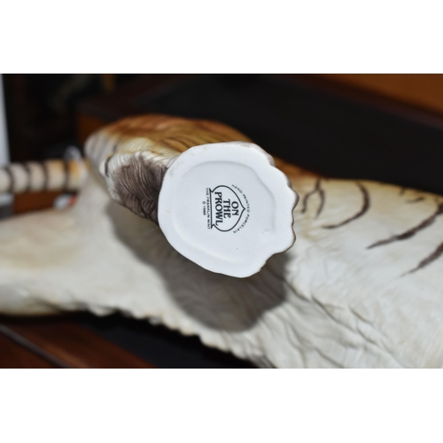 680 - TWO FRANKLIN MINT HAND PAINTED PORCELAIN BIG CATS, comprising a Lion 'Monarch of the Serengeti' appr... 