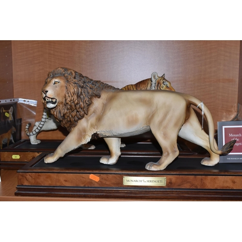 680 - TWO FRANKLIN MINT HAND PAINTED PORCELAIN BIG CATS, comprising a Lion 'Monarch of the Serengeti' appr... 