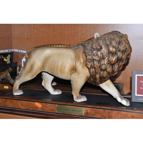 680 - TWO FRANKLIN MINT HAND PAINTED PORCELAIN BIG CATS, comprising a Lion 'Monarch of the Serengeti' appr... 