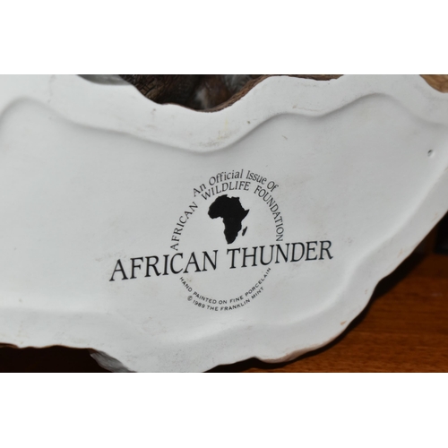682 - TWO HAND PAINTED PORCELAIN FRANKLIN MINT SCULPTURES, comprising 'African Thunder' an African Black R... 